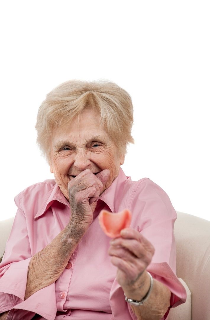 Cheeky elderly woman with denture